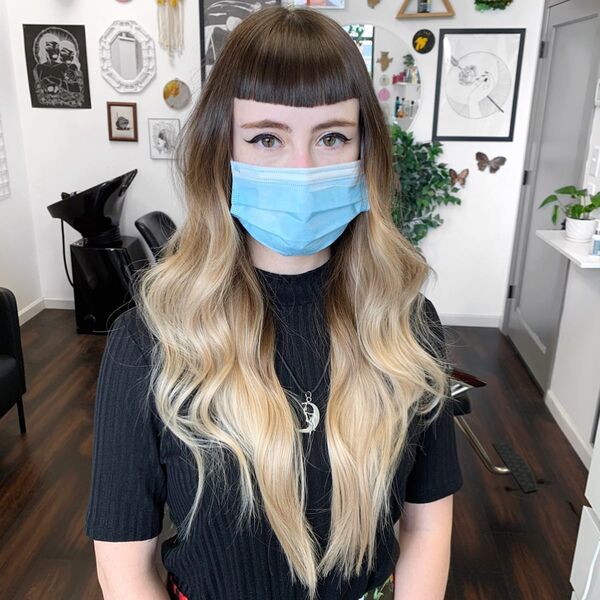 Crop Fringe With Blonde Tip - a woman wearing a face mask