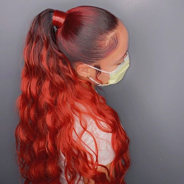 Curly Classic Ponytail with Hair Color - A woman wearing a facemask