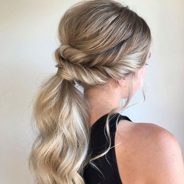 Faux Fishtail Ponytail Updo - A woman wearing a black sleeveless top