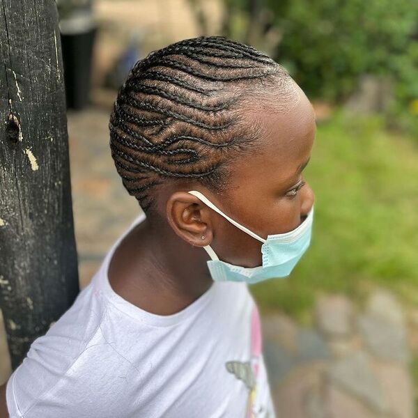 Freestlyed Cornrow Braids - A woman with surgical facemask wearing a white printed shirt