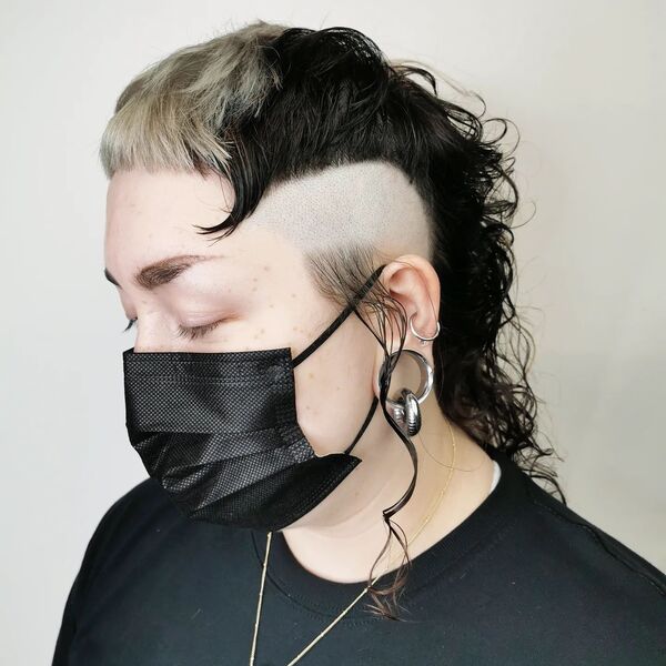 Fresh Shave & Skunk Stripe Hairstyle - a woman wearing a face mask