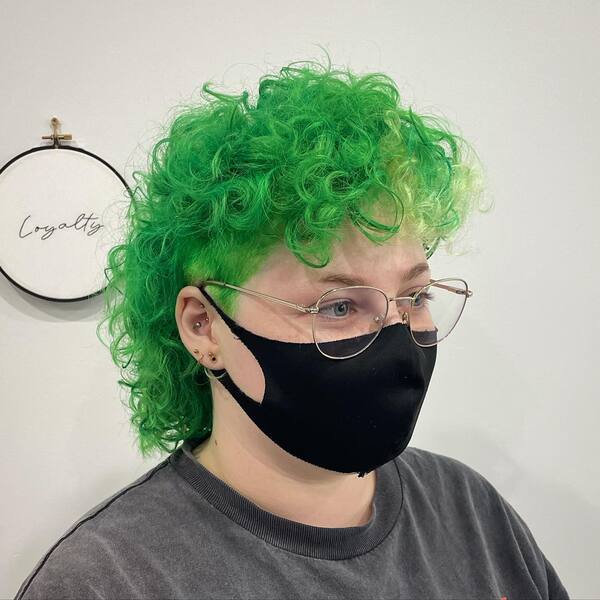 Green Tone Curly Mullet - a woman wearing a black face mask