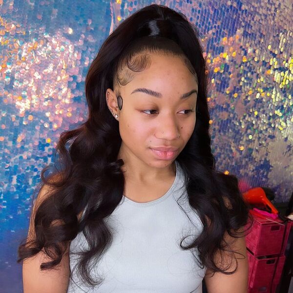 Half Sew in Ponytail with Curl - A woman with nose piercing wearing a sleeveless shirt