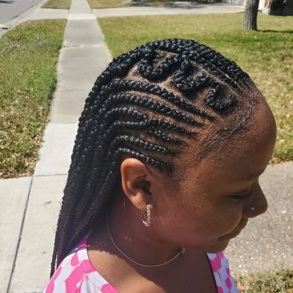 Half Up Half Down Cornrow Braids with Design - A woman wearing a earrings