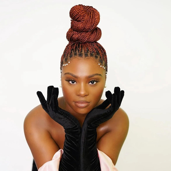High Bun With Accessories - a woman wearing a long gloves