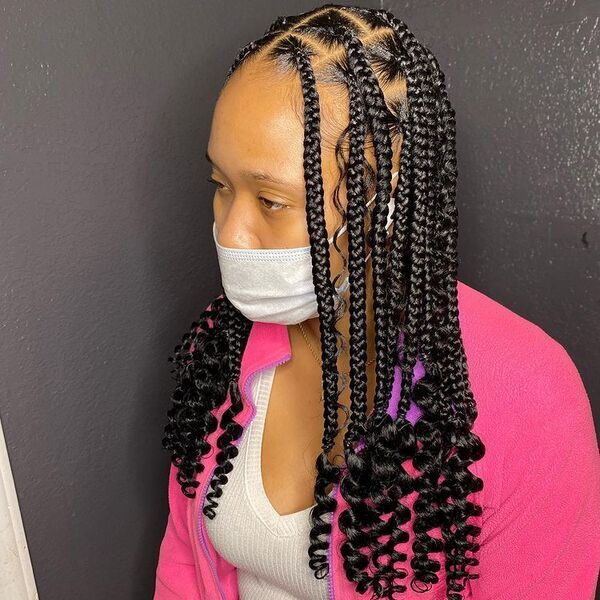 Knotless Braids with Curly at the End - A woman wearing a pink jacket
