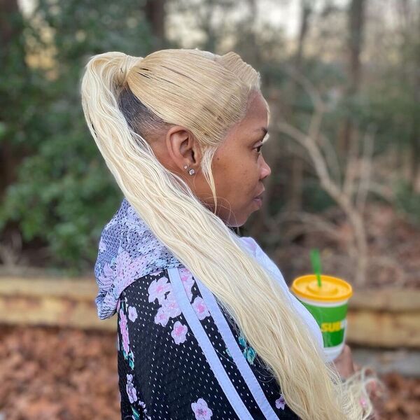 Lace Frontal Hairdo with Blonde - A woman wearing a floral jacket