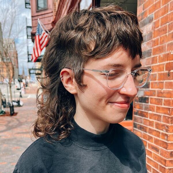 Mullet Fringe & Curls - a woman wearing an eyeglasses