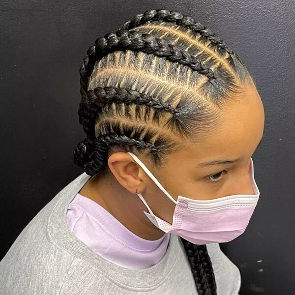 Layers Cornrow Braid - A woman wearing a pink facemask