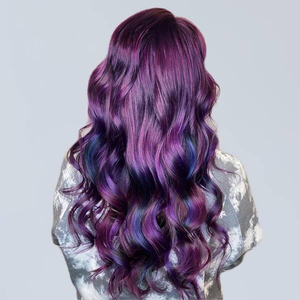 Long & Curly Galactic Style Galaxy Hair Color Ideas - a woman in a back view