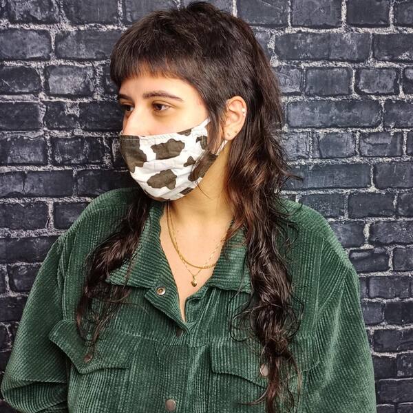 Long & Disconnected Mullet Hairstyle - a woman wearing a printed face mask
