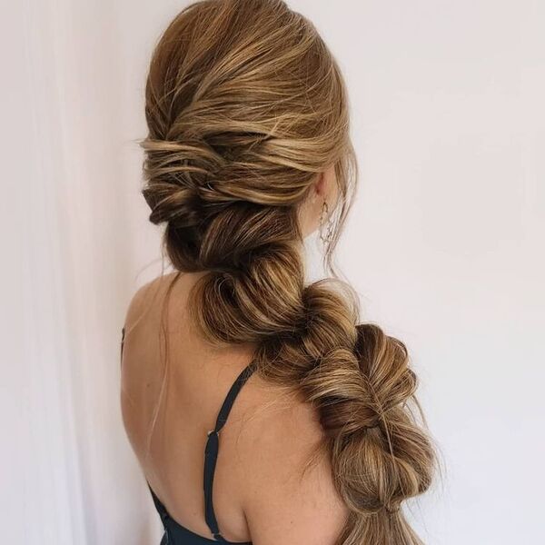 Loose Jumbo Braid Ponytail - A woman wearing a sexy top