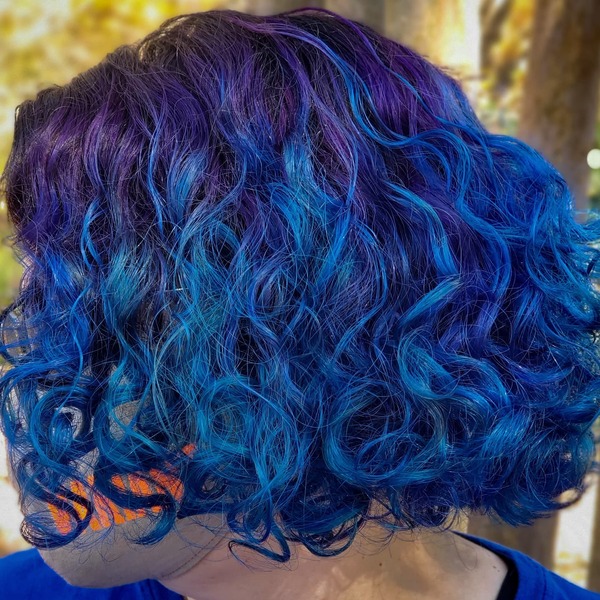 Magical Blue Curly Bob - a woman in a back view