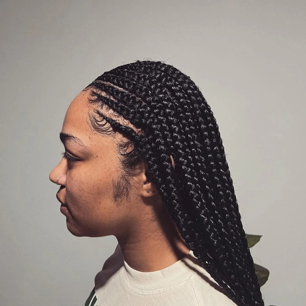 Medium Fulani Knotless Braids - a woman in a side view