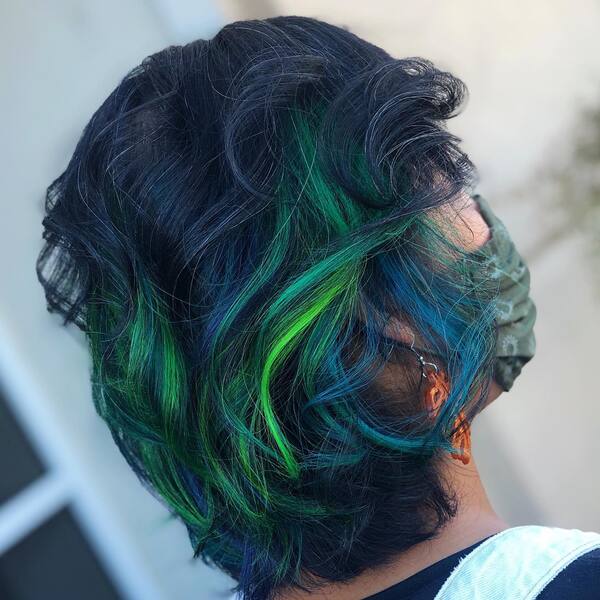 Messy Cosmic Strands Galaxy Hair Color Hairstyle - a woman in a back view