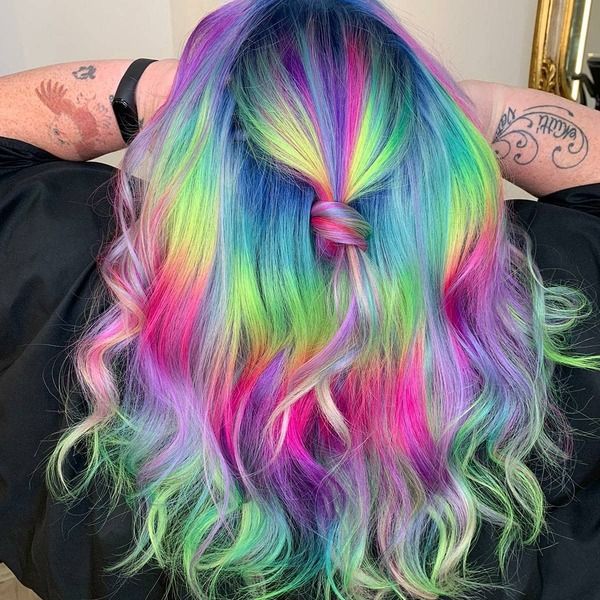 Messy and Medium Rainbow Hair Color - A woman with tattoo wearing a black cape