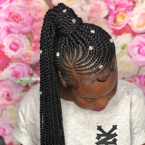 Neatly African Cornrow Braid Hairstyles in a Ponytail with Beads - A woman with hair decor wearing a gray shirt