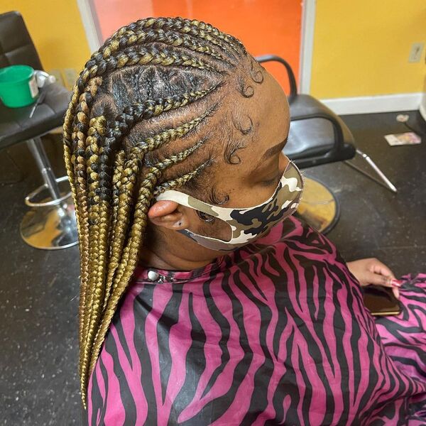 Ombre Layer Cornrow Braid - A woman wearing a printed cape