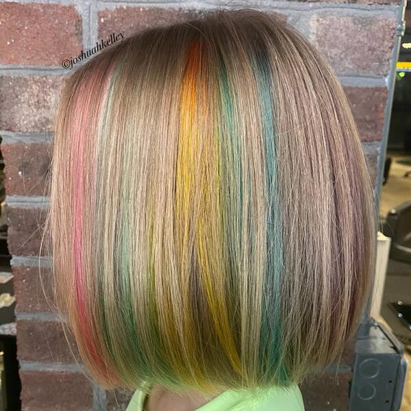 Pastel Rainbow Hair Color - A woman wearing a apple green shirt