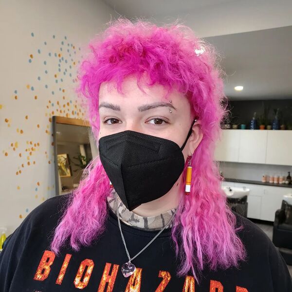 Pink Hair Curly Mullet Hairstyles - a woman wearing a black face mask