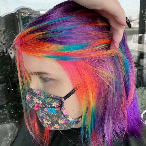 Pulp Riot and Rainbow Hair Color - A woman wearing a printed facemask
