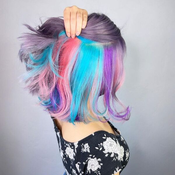 Rainbow & Unicorn Hair Color - A woman wearing a black floral blouse