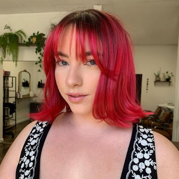 Red Hair and Fine Bangs for Wavy Hair - a woman in with red hair