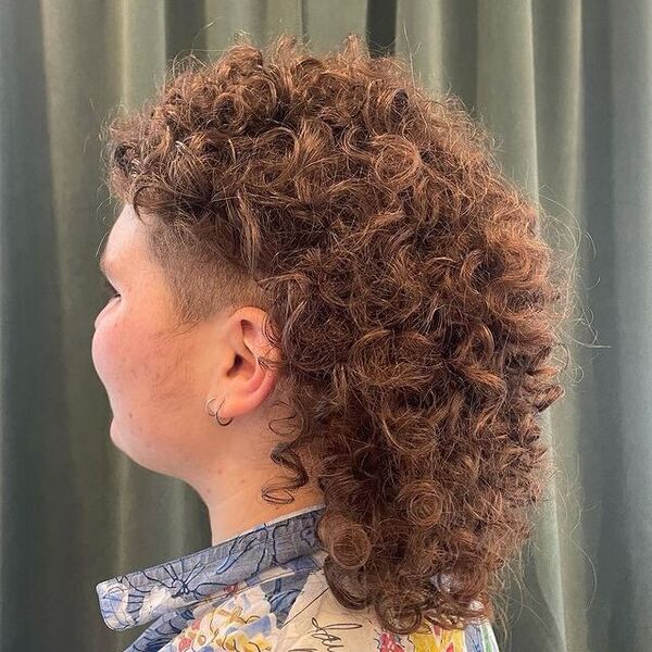 Shaggy Curly Mullet Hairstyle - a woman in a side view