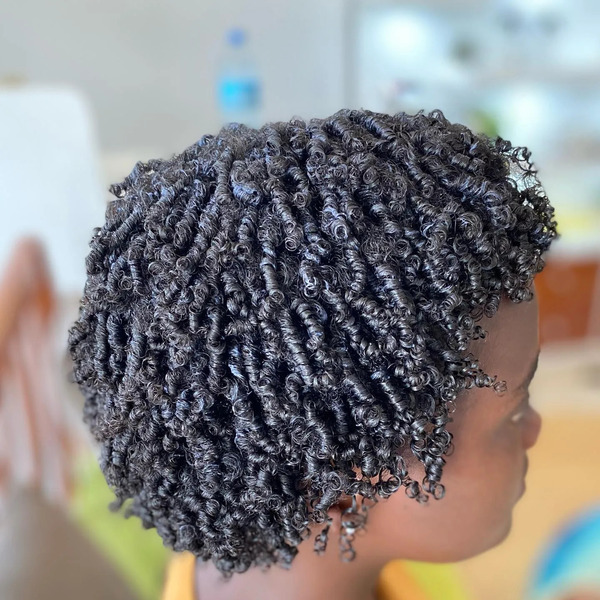 Finger Coils Natural Hairstyles for Women- a woman in a side view