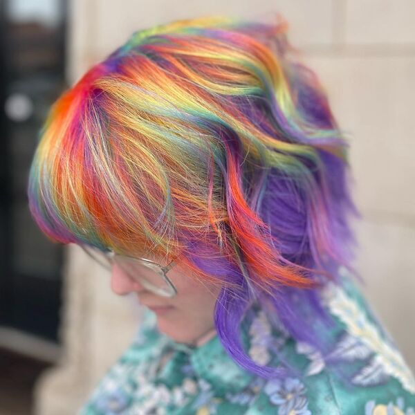 Short Vivid and Rainbow Hair Color - A woman wearing a eyeglasses