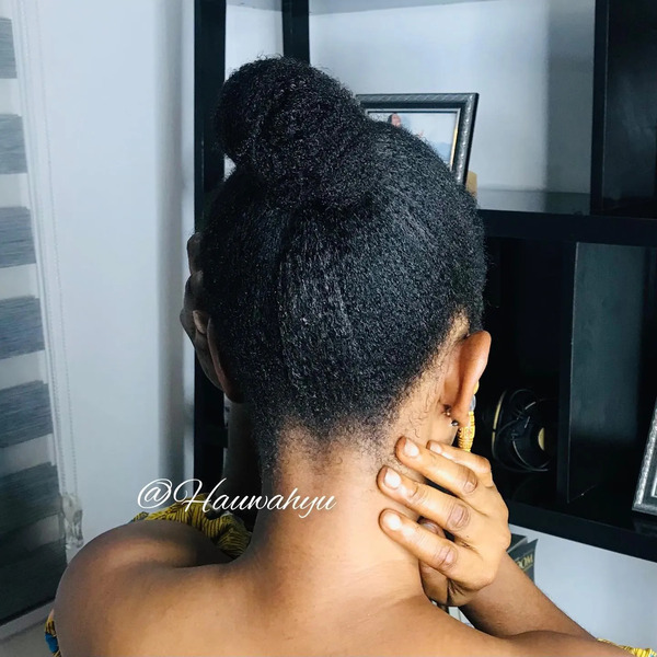 Simple Middle Bun Natural Hairstyles for Women - a woman in a back view