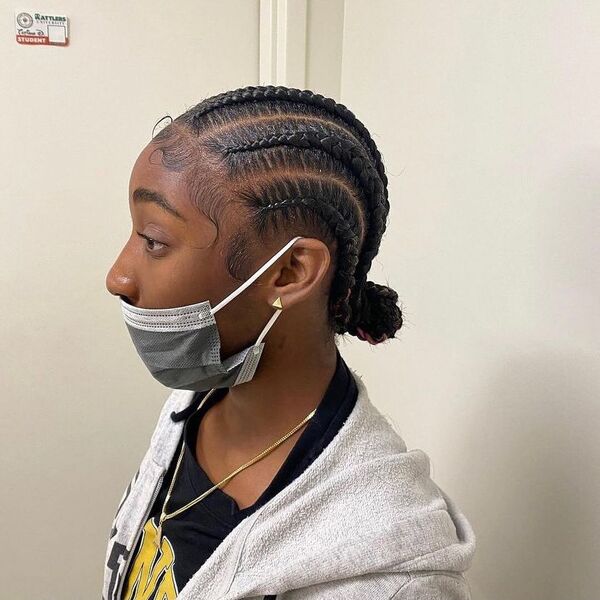 Small Feed in Cornrow Braid with Bun - A woman with facemask wearing a gray jacket