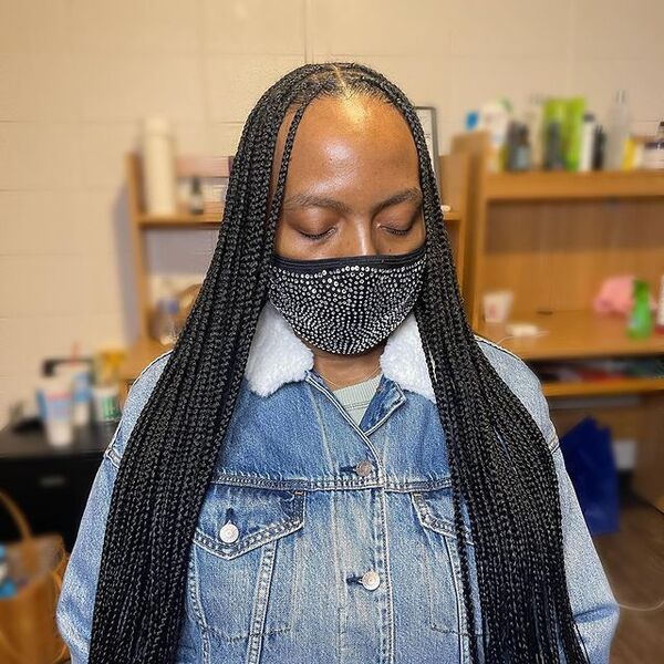 Small Knotless Braids - A woman with facemask wearing a denim jacket