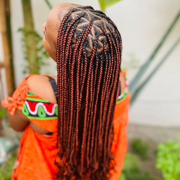 Small Triangle Braided Hairstyles with Ombre - A woman wearing a orange duster