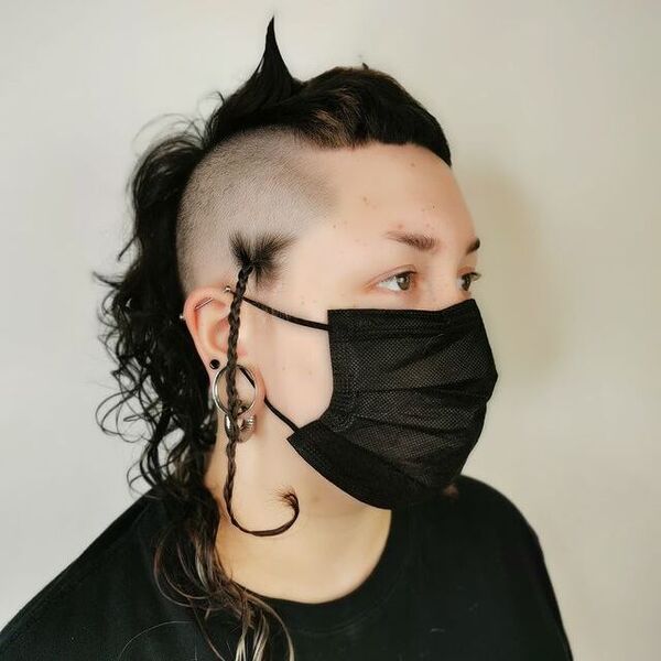 Spooky Curly Mullet - a woman wearing a black face mask