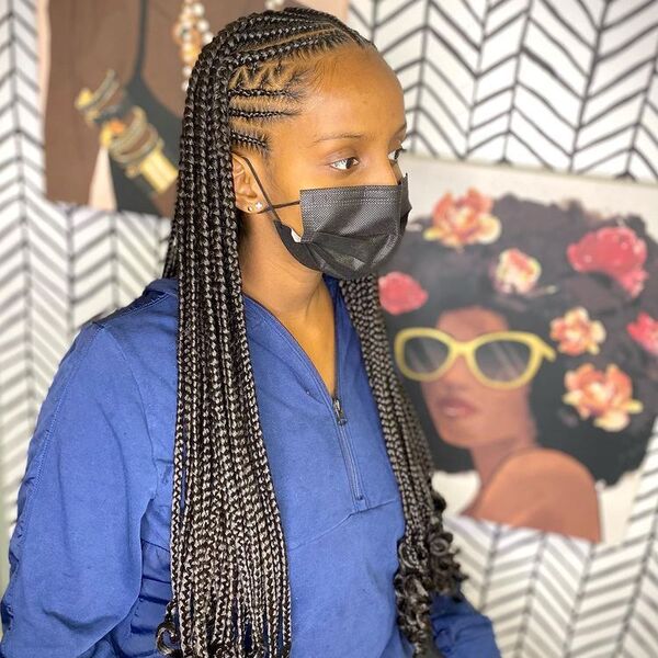 Stitch Cornrow Braids with Curl at the End - A woman with black facemask wearing a blue jacket