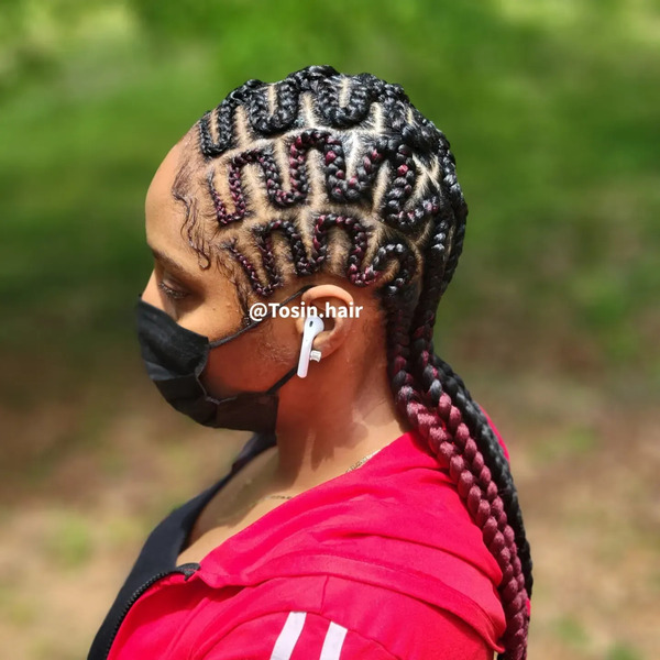 Styled Zigzag Braids - a woman wearing a face mask