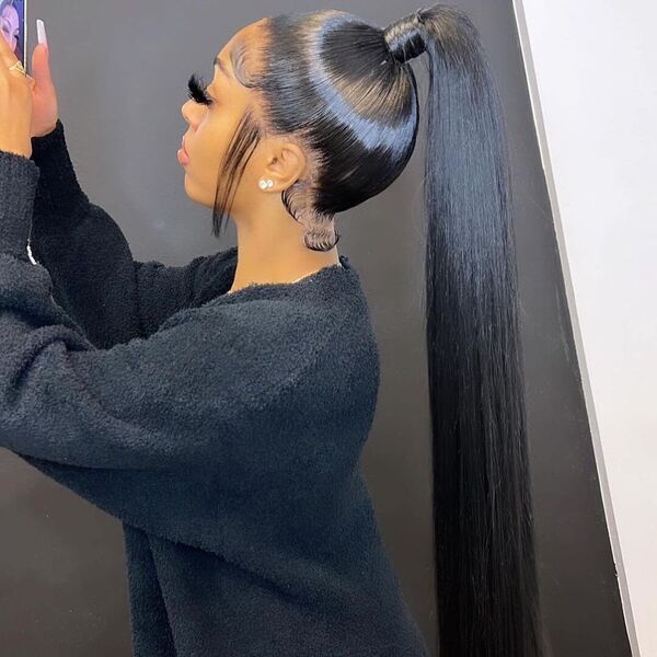 Super Long Ponytail - A woman wearing a black sweater