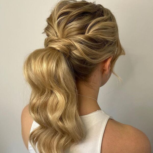 Two Different Waves Ponytail Updo - A woman wearing a white sleeveless top