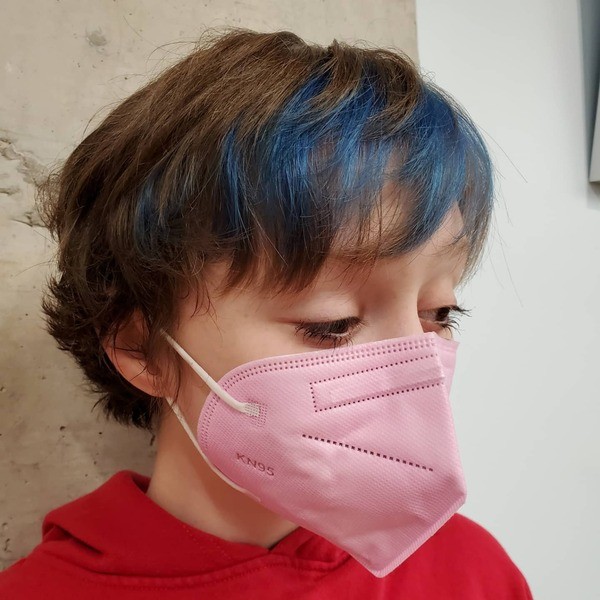 Adorable Hidden Blue Hair Panel - a woman wearing a face mask