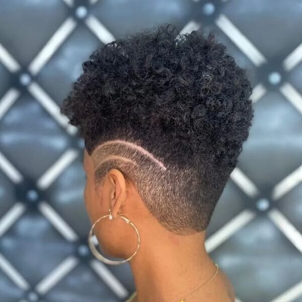 Afro Hair with Undercut - a woman in a side view