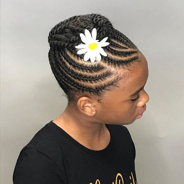 Afro Twists Braids and Flower - a girl wearing a black shirt