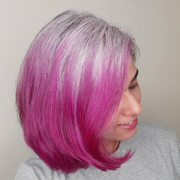 Ashy Pink Reverse Ombre Hair - a woman in a side view