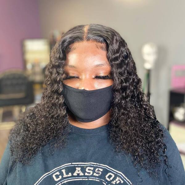 Baddie Hair with Deep Wave Bundles - a woman wearing a black face mask