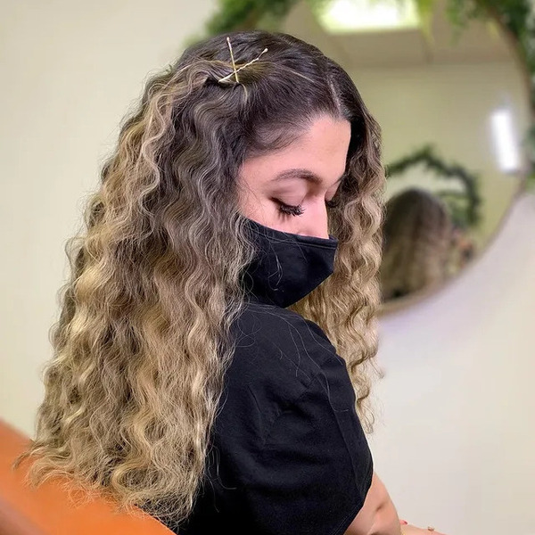 Balayage Crimped Hair - a woman wearing a black face mask