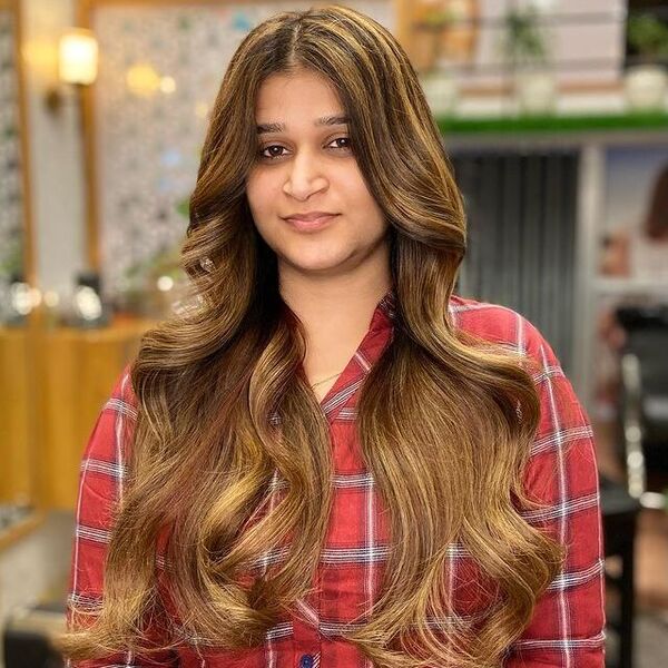 Balayage with Classic Highlights - a woman wearing a checkered polo