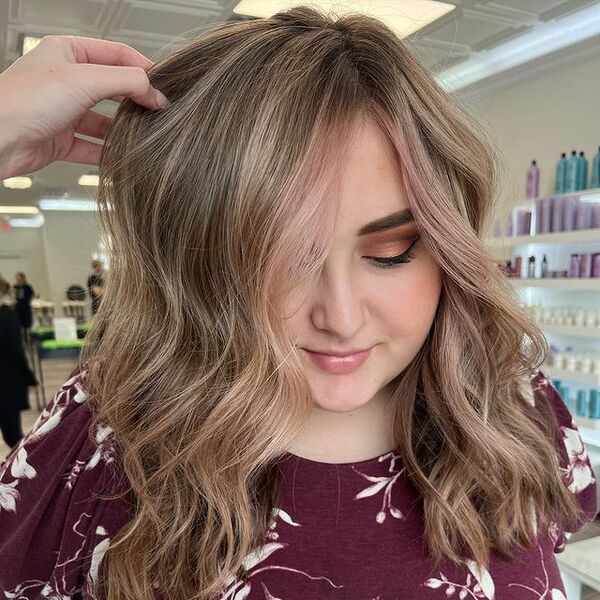 Beachy Waves Hairstyle with Rosy Blonde - a woman wearing a dress