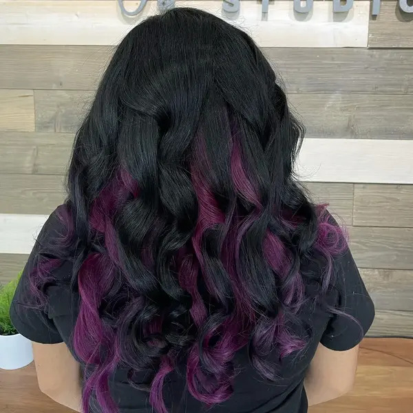 Beachy Waves with Dark Purple and Black Hair - a woman in a back view