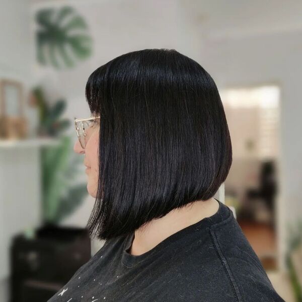 Black Hair and Angled Bob Haircut - a woman in a side view