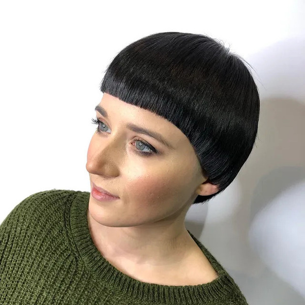 Black Hair and Round Shape Mushroom Cut - a woman wearing crochet shirt